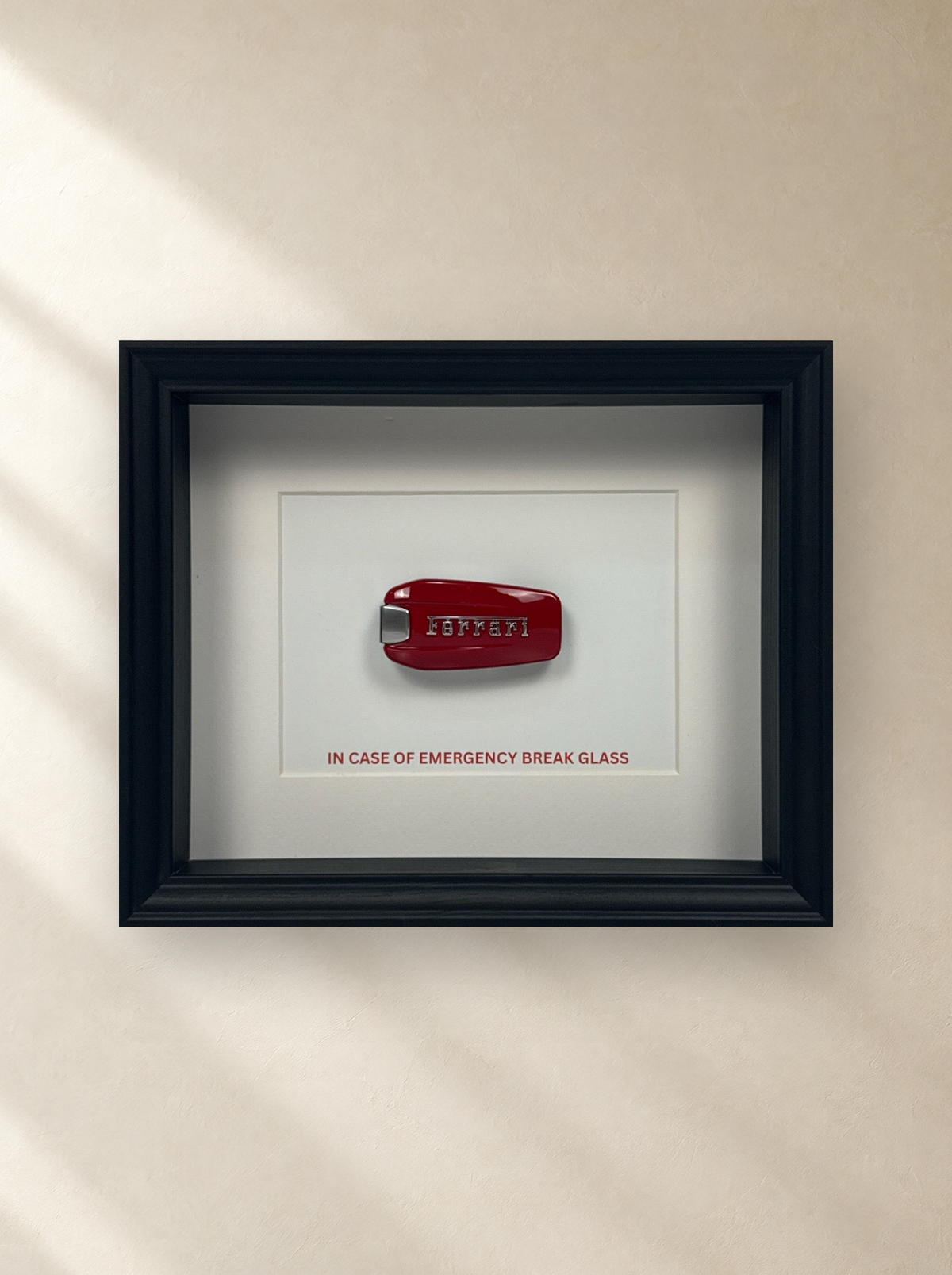 Emergency Ferrari Key Frame by Uhoh Studio on a gallery wall