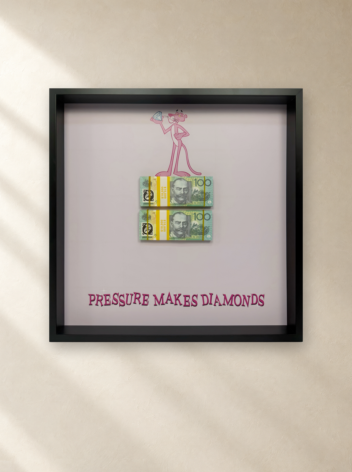 Pink Panther's Pressure frame (52 x 52 cm) hung on a warm plaster wall – Uhoh Studio