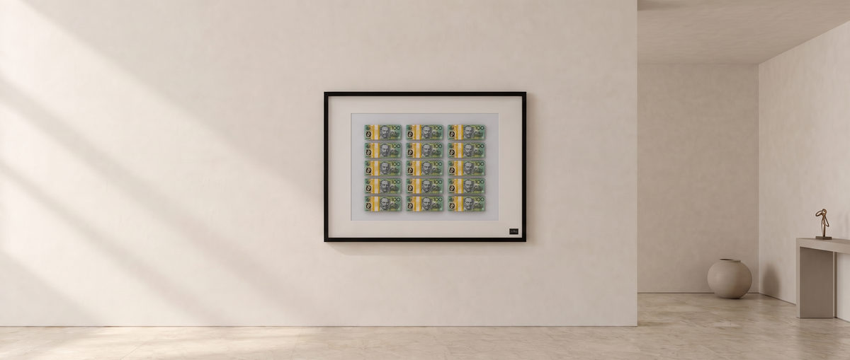 Uhoh Studio framed 15-stack money artwork on a gallery wall